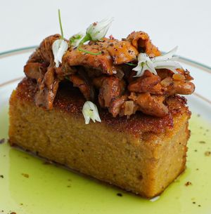 fried polenta • sautéed chanterelles • chive infused oil • wild garlic flowers  at Venn Canteen in Porto