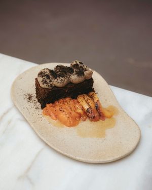 acorn flour · eggplant and sesame cream · pickled stone fruit · nigella seeds · powdered aromatic vegetable ash at Venn Canteen in Porto