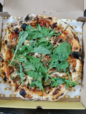 Abundance with pesto, eggplant, mushrooms, rucola, and added mozzarella at Pizza Cult in Ubud