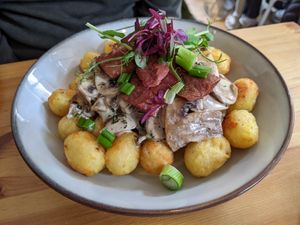 Creamy mushroom & facon tater tots brunch at Tigs Bagel & Coffee House in Sheffield