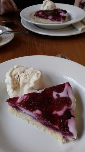 Raspberry and coconut tart with ice cream (all vegan) at Pumpernickel Coffee Shop in Dumfries