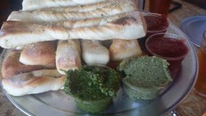Breadsticks with cilantro pesto and basil cashew sauces at Sizzle Pie - E Burnside in Portland