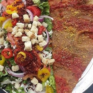 Rabbits Salad with Spiral Tap Pizza Slice at Sizzle Pie - E Burnside in Portland