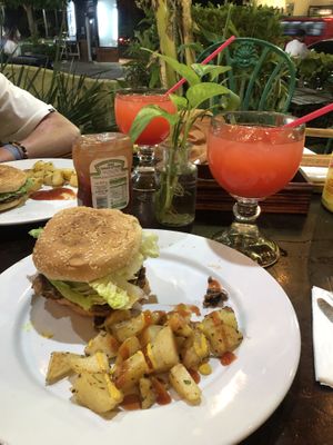 Vegan burger with potato’s   at Natura Restaurante in Cancun