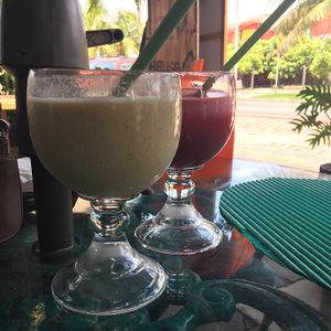 one amaranth and banana and one beet and carrot at Natura Restaurante in Cancun