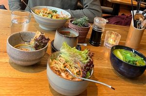buddha bowl, spring rolls, coconut salad and green curry at Udum in Cologne