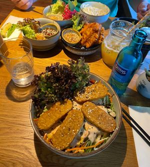 Vegan bowl with tempeh and brown rice and many vegan tapas  at Udum in Cologne