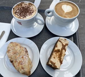 Almond croissant, sticky toffee biscoff cake, oat cappuccino & oat lattee  at The Park Café in Aberdeen
