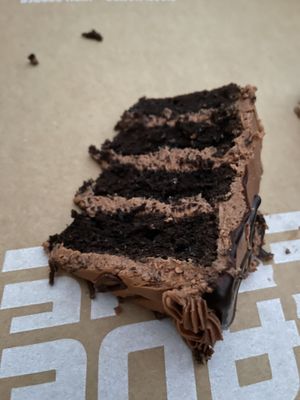 Unfortunately didn’t get a photo of the whole cake - here is a slice - 1/12th of the cake - yum!  at Mr. Natural - East Cesar in Austin