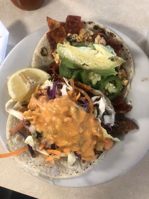 Vegan tacos - chilaquiles and seitan fish taco at Mr. Natural - East Cesar in Austin
