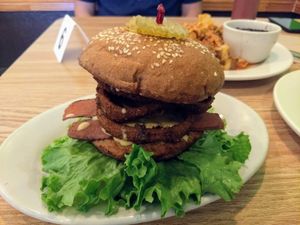 Bacon cheeseburger with onion rings at Mr. Natural - East Cesar in Austin