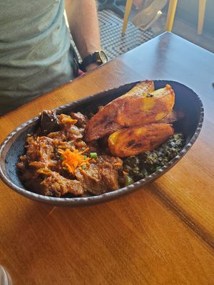 Intore - Eggplant stew, peanut-stewed spinach, pilaf rice, and fried plantains at Baobab Fare in Detroit