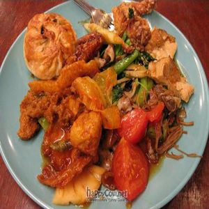 Plate of food from buffet & BBQ pork bun at Fo Guang Vegetarian in Kuala Lumpur