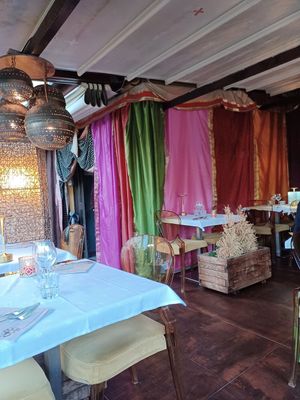 Outdoors seating area at Le Taj in Menton