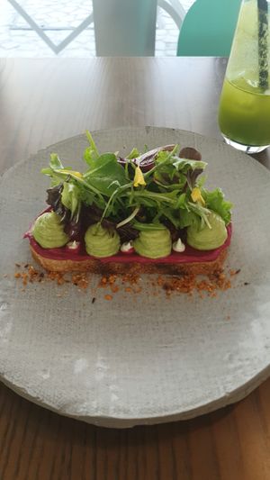 Avo with beetroot humous on sourdough at Thalatheen  in Doha