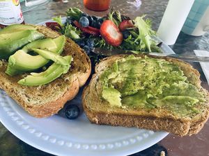 Avocado toast with fruit and greens—only $6.99!  at Good Vibes "On the River" Restaurant & Bakery in Townsend