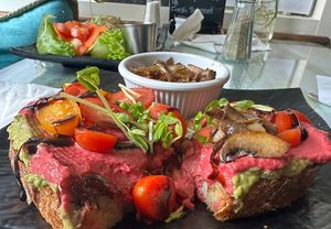 Made it up, and they let me!  Delicious, guacamole toast with beet hummus and sautéed onions/mushrooms (side of hot sauce recommended). Delicious!  Staff is super nice and helpful at Ohana Cafe in Saugerties