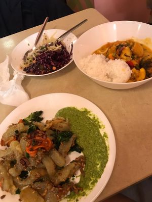 Kind of potato dumplings with pesto, curry + mix of salads  at Zloty Osiol in Katowice