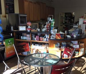 Some of the seating, and a view of the cafe bar. Can see the kombucha on tap. at Health Hutt in Norton Shores