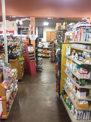 The Cafe Menu on the back wall as seen while walking around the rest of the store. Lots of stuff in the store! at Health Hutt in Norton Shores