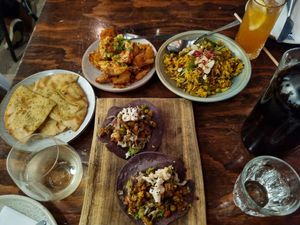 Flat bread with herbs,  fried potatoes with tahini, veg biriyani & tacos at Bivouac Canteen & Bar in Perth
