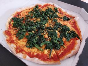 Spinach pizza with vegan cheese at Baba Grill in Mannheim