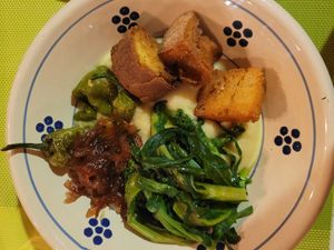 piatto del contadino: mashed fava beans with green peppers, chicory, caramelised onions and fried bread at Masseria Stali in Caprarica Di Lecce