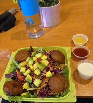 Banana blossom crab cakes with avocado, mixed greens and choice of sauces  at Natuurlik in Boynton Beach