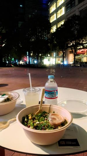 Custom Earthy Nutty Crunchy signature salad (tofu, beans, broccoli, walnuts, seeds). Outdoor seating in front of Coredo.  at Crisp Salad Works - Coredo Muromachi Terrace in Tokyo