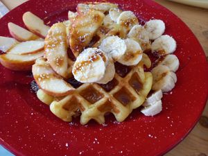 Vegan & Gluten-Free Sweet Potato Waffe with fruits and nuts at Roots in Aljezur