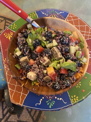 Salad bowl with black rice, veggies, vegan cheese and blueberries! Very tasty!   at Roots in Aljezur
