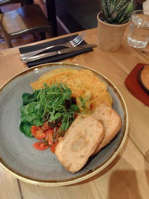 Chickpea omelet with GF sourdough toastm pea sprouts, spinch, olive tapenade, and cherry tomato salsa at Source in York