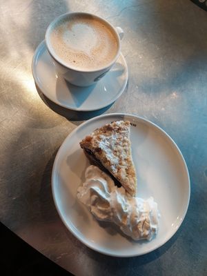 Vegan blueberry cake with vegan cream, cappuccino at Espresso House in Trondheim