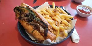 Hot dogs with garlic mushrooms, fried onions and 'skin on' fries at Emma's Diner in Whitby