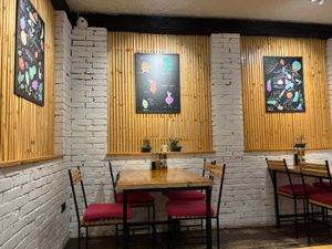 Interior dining area with decor at Crust n Crumb in Pristina