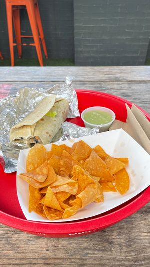 Burrito, chips, and salsa verde at Mosquito Burrito in Cleveland