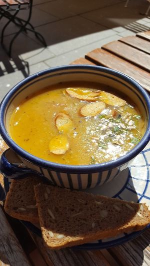 The soup with slices of vegan sausage (frankfurter) in it. at Aha Cafe in Dresden