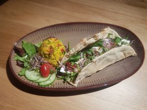 Arabic bread with fetaah( vegan), red onion, sundryed tomato, koriander, rucola and mint. Served with couscous salad. Just €6.95 at Bibliotheek Oosterschelde in Goes
