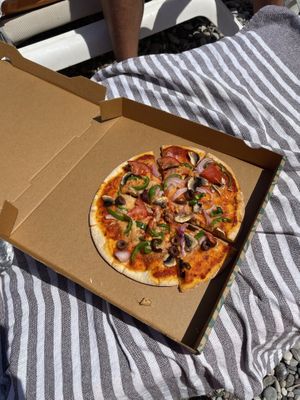 Gluten free pizza with the ”parmesan” cheese  at Orexi in Rhodes