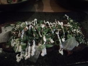 Okonomiyaki
Japanse witte kool en wortelpannenkoekjes, spinazie, zeewiersalade, avocado, daikon pickle, misomayonaise, lente-ui, furikake at Thibeau in Nijmegen