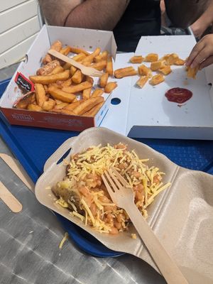 Vegan sausage and Chips (2 small sausages, Ketchup Costs extra) + vegan jacket potato with beans and cheese at Sovereign Light Café in Bexhill