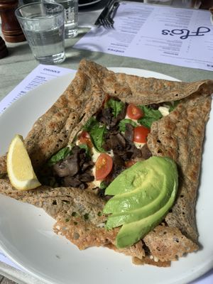 Spinach avo mushroom galette with vegan cheese and added cherry tomatoes. Bon appetite!  at Flo's Crêperie in Noosa Heads