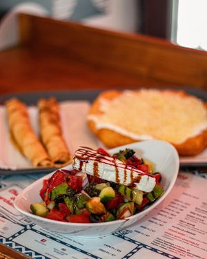 Greek salad, lángos, and pancakes at Retró Lángos Budapest in Budapest