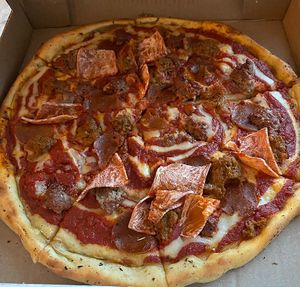 Large meat lover’s pizza at Meek's Vegan Pizza in Houston