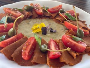 “Vitello non tonnato e felice” a base di Seitan fatto in casa e maionese vegetale at Isolino Ristorante Wine Bar in Locarno