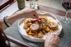 Arrosto di Seitan ai ceci bio fatto in casa con salsina al Cognac e timo, servito con verdurine e patatine novelle al forno at Isolino Ristorante Wine Bar in Locarno