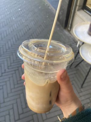 Iced latte with caramel syrup and oat milk  at Coffee Company in Delft