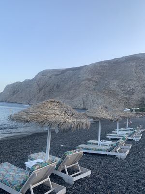 beach chairs belonging to restaurant at Poseidon in Santorini