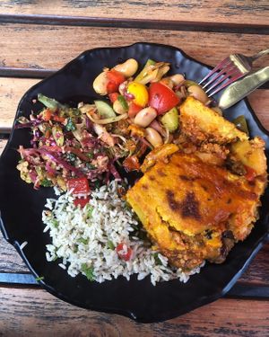Moussaka with rice, couscous and beansalad  at Kiez Vegan - Körtestraße in Berlin