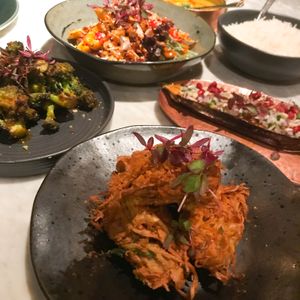 Mango coconut salad, tandoori broccoli, smoked aubergine, onion bhaji   at Khai Khai in Newcastle Upon Tyne